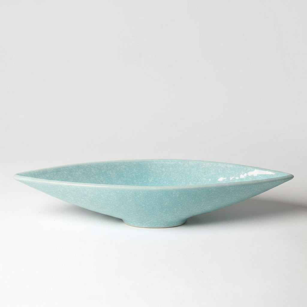 Studio shot of turquoise crackle glaze decorative bowl