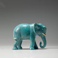 Side profile of turquoise patina brass elephant sculpture
