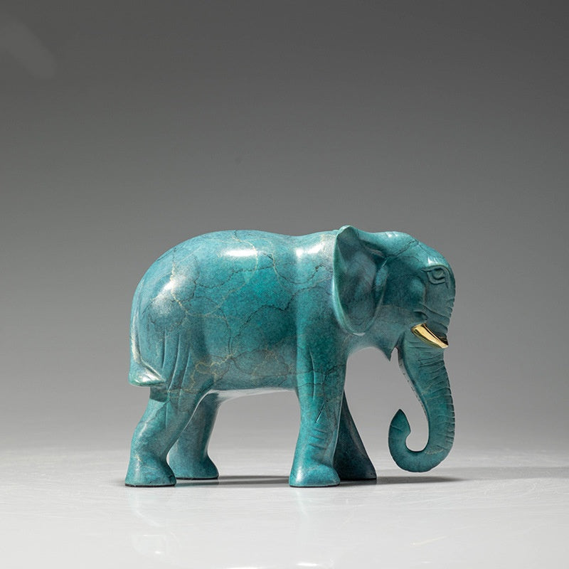 Side profile of turquoise patina brass elephant sculpture