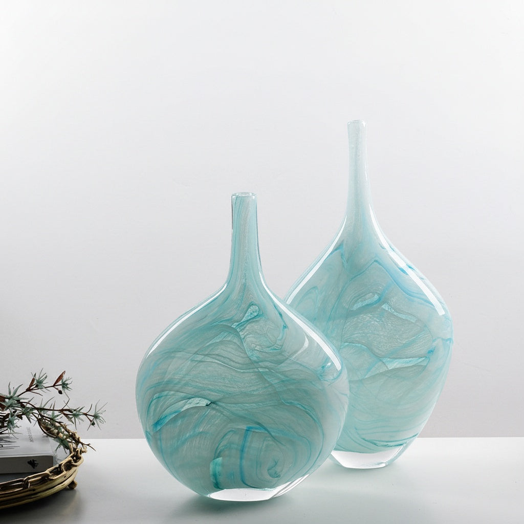 Turquoise swirled art glass vases on table