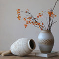 Two-tone ceramic vase with autumn branches