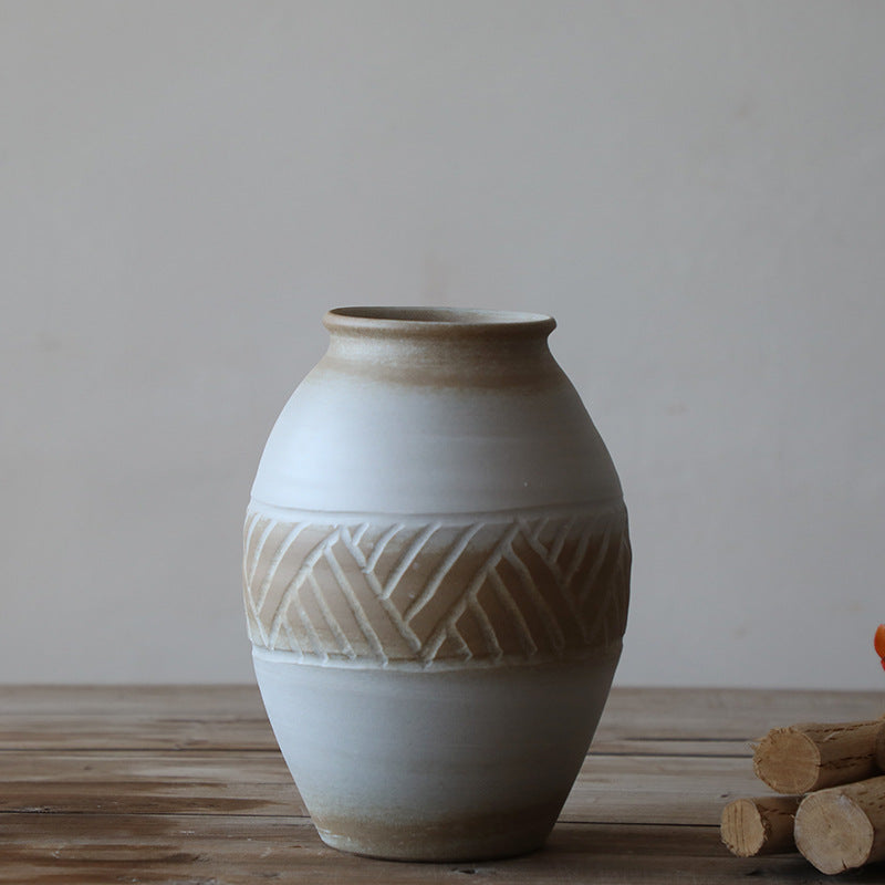 Close up of geometric carved detail on ceramic vase