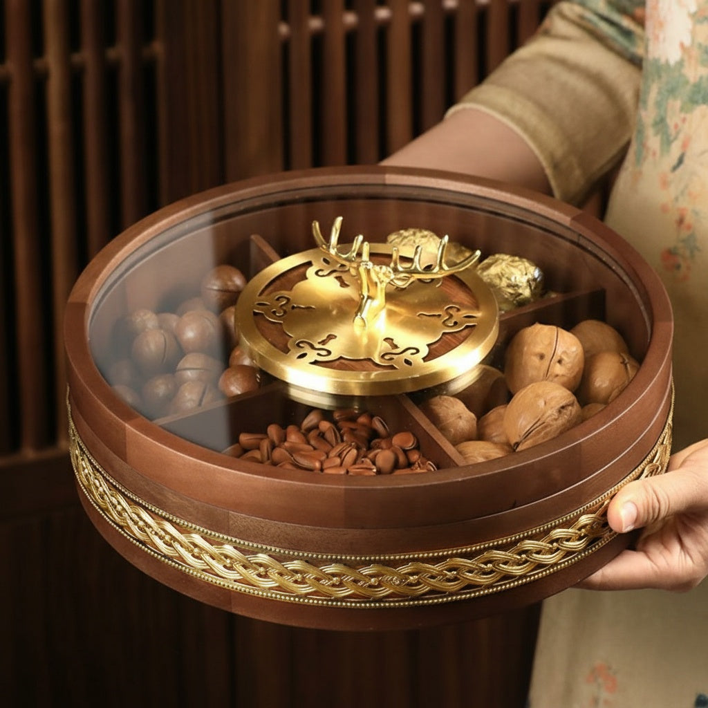 Hand holding round walnut snack box with divided compartments