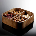 Interior view of wooden snack box with four compartments filled with nuts