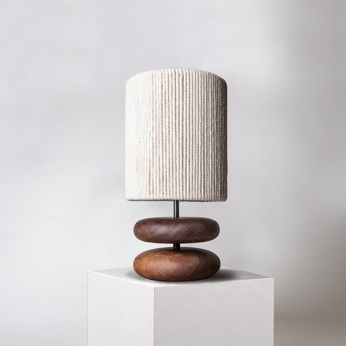 Walnut wood stacked pebble table lamp with textured shade front view