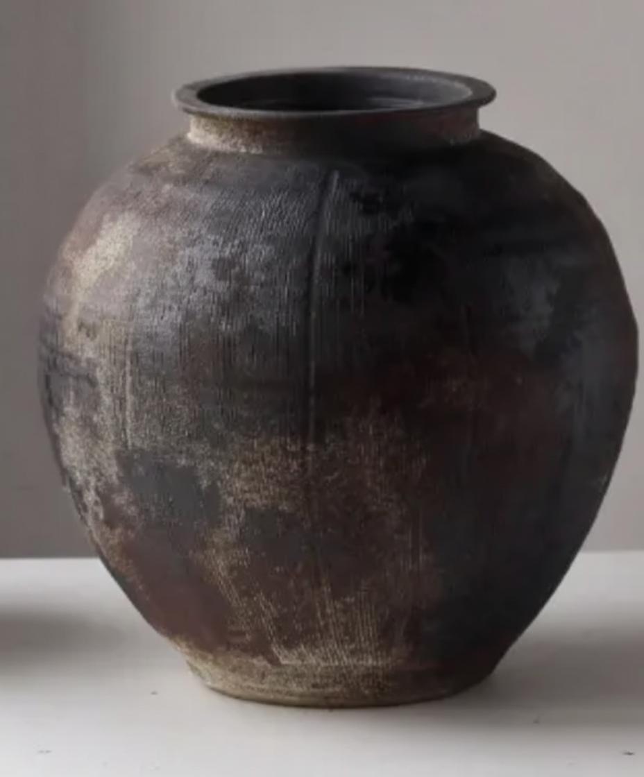 Detail of rustic ceramic vase rim and finish