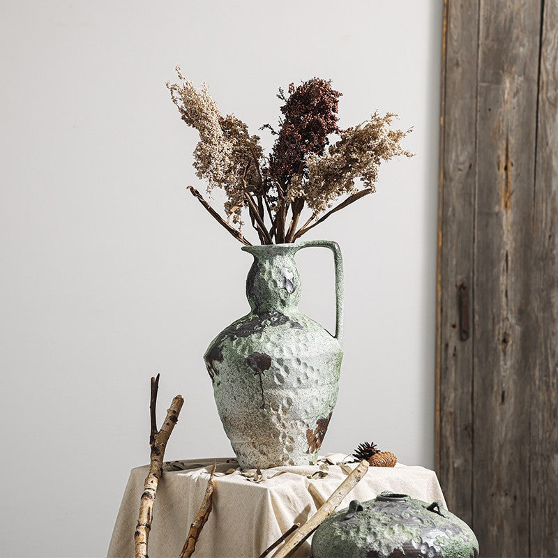 Rustic moss green ceramic pitcher vase with dried flowers