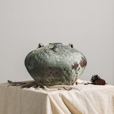 Squat weathered ceramic jar vase with lug handles