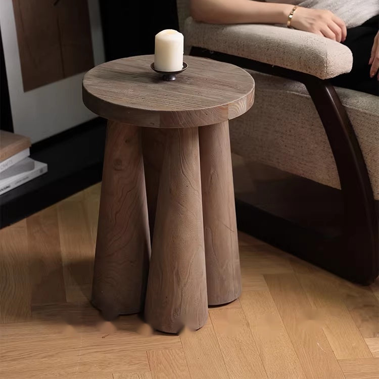 Weathered solid wood round side table with candle