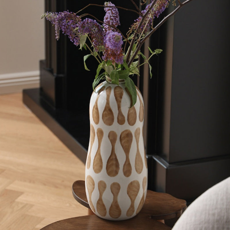 Detail of white and brown pattern on ceramic vase