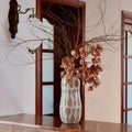 Patterned ceramic vase styled in hallway setting