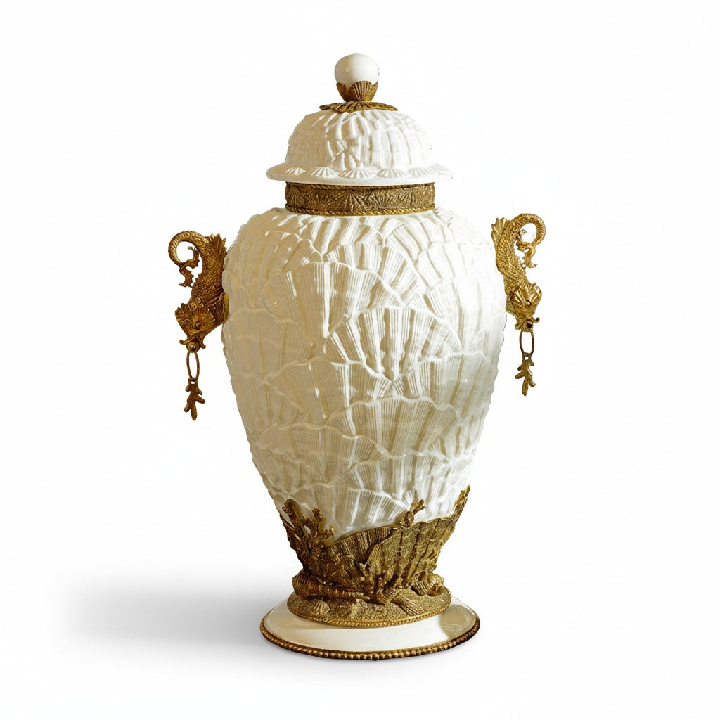Full isolated view of white ceramic and brass lidded urn