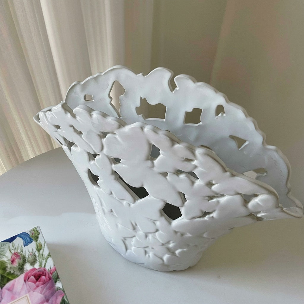 Top angled view showing the pierced butterfly design