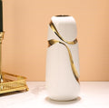 Tall white ceramic cylinder vase with sweeping gold accent