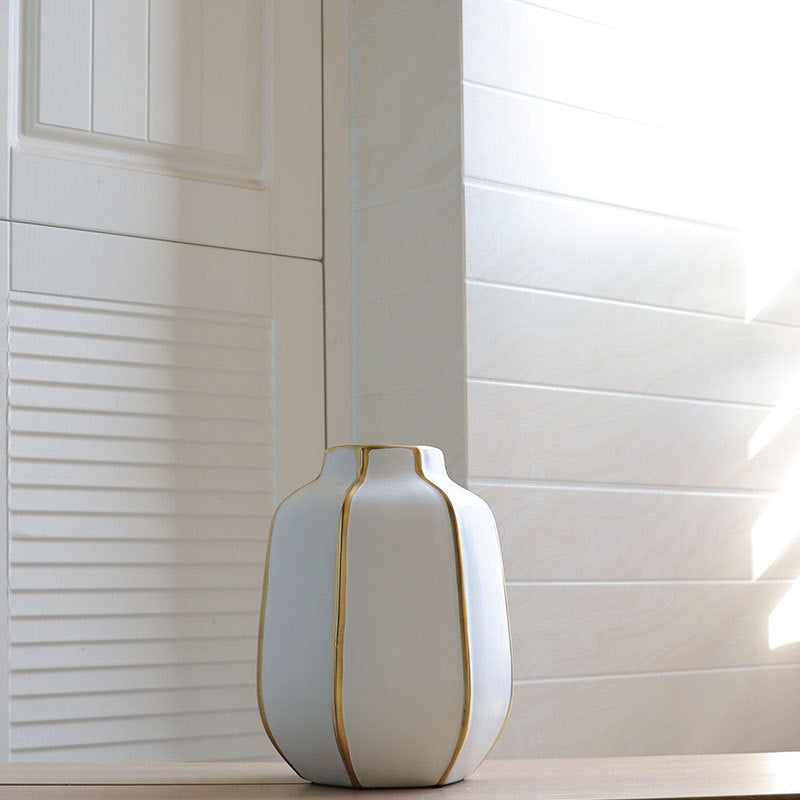 Front view of medium white ceramic vase with gold details