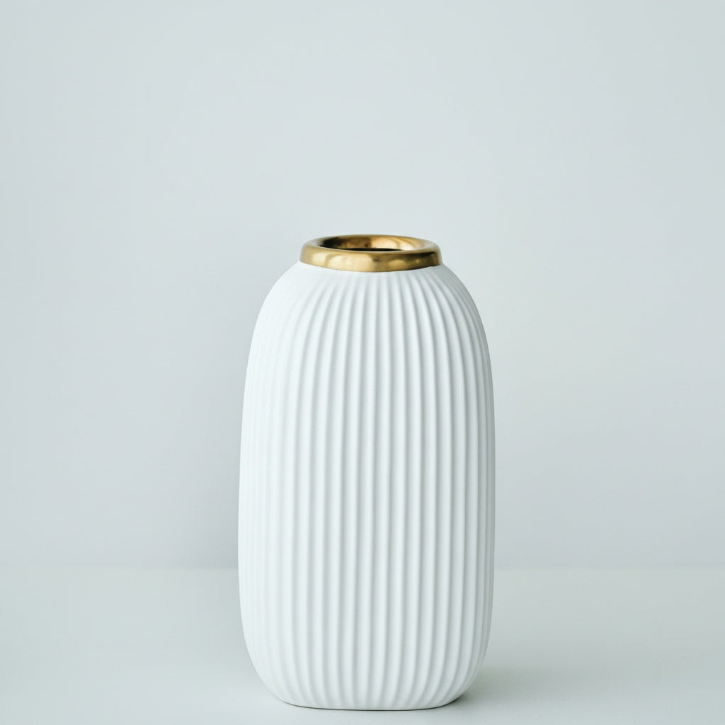 Front view of white ribbed ceramic vase with gold rim