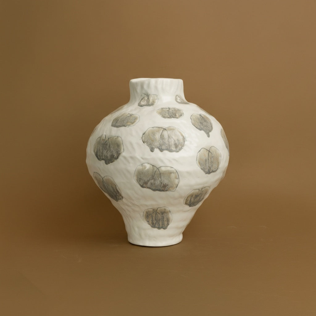 Large white ceramic bulbous vase with textured surface