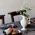 White Ceramic Pedestal Pitcher Vase on Dining Table