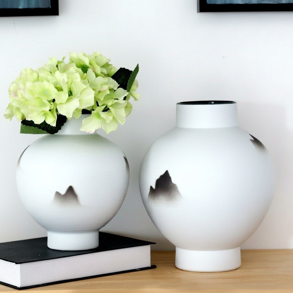 White ceramic spherical vase with landscape design
