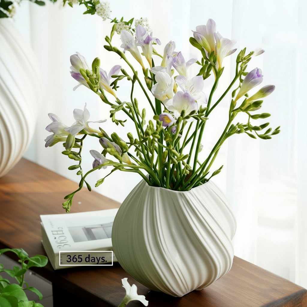 White Ceramic Swirled Vase Styled With Flowers