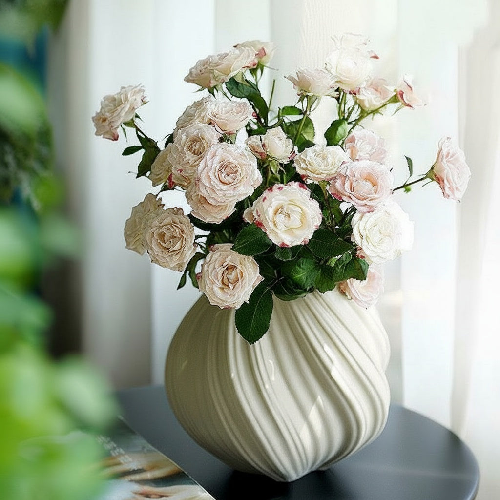 White Ceramic Swirled Vase On Dark Table