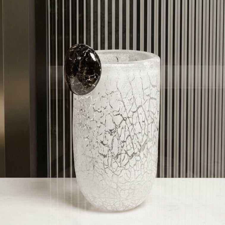 Close up of large white frosted crackle vase with black detail
