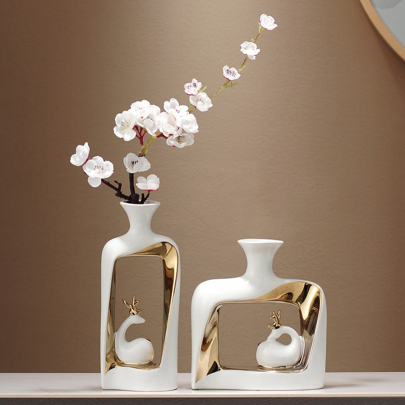 Set of two luxury ceramic vases with flowers styled on table