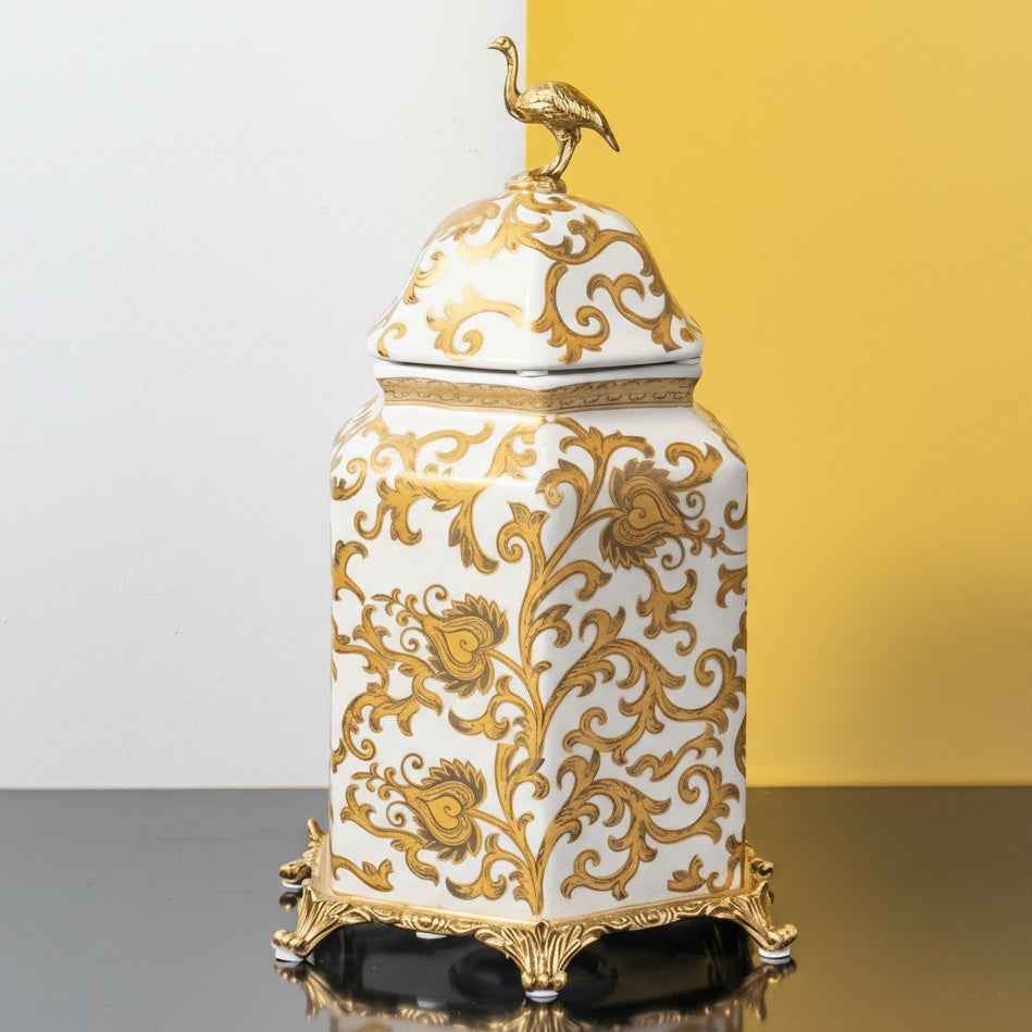Large white and gold ornate ceramic jar on stand