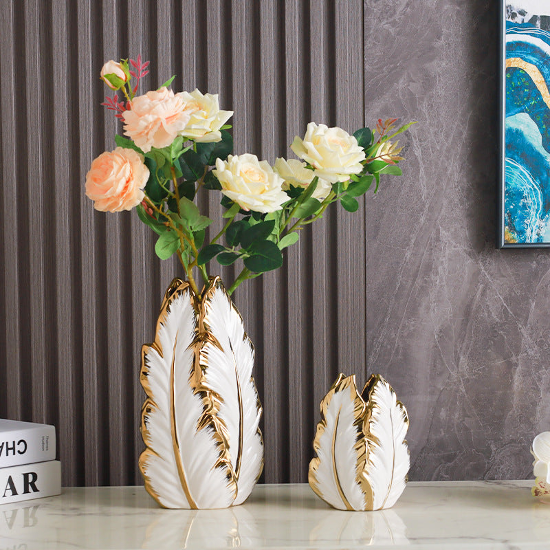 Ceramic feather vase with floral arrangement