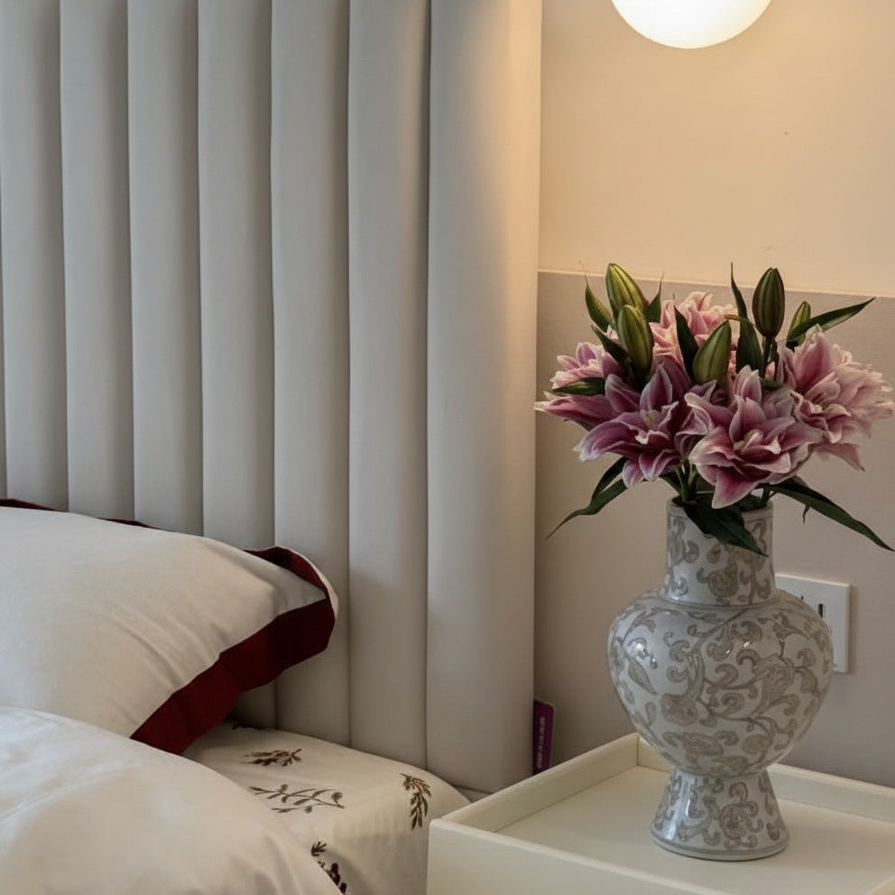 Lifestyle shot of ceramic vase on bedside table