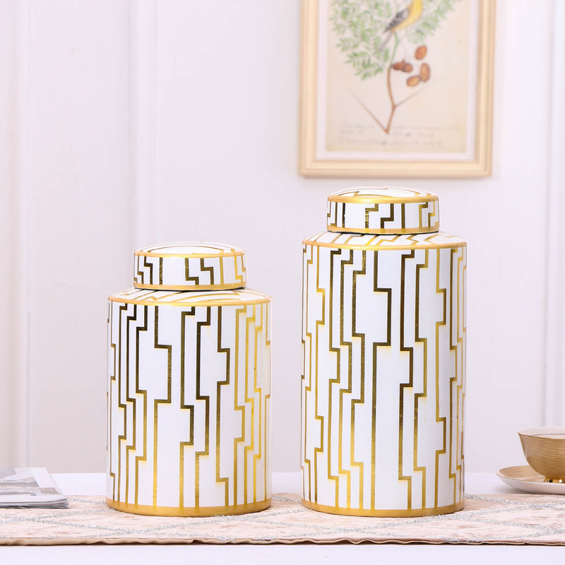 White and gold ceramic ginger jars with geometric pattern