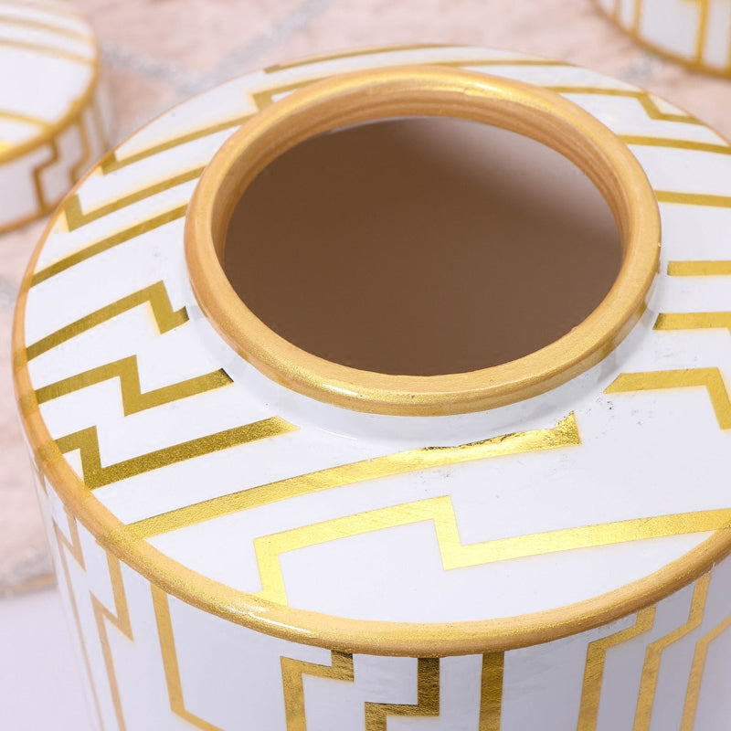 Close up detail of gold geometric pattern on ceramic lid