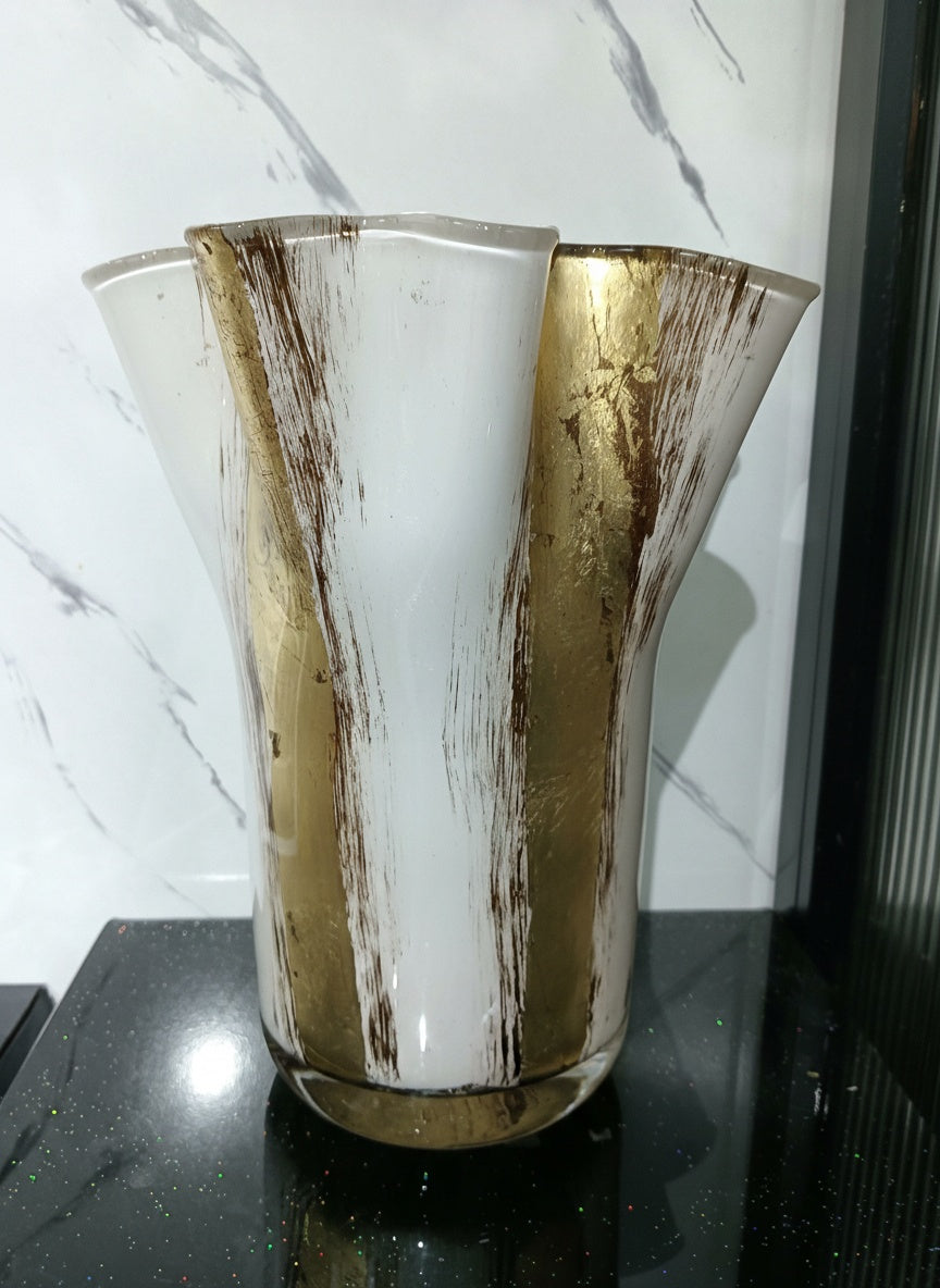 Front view of empty white and gold flared vase