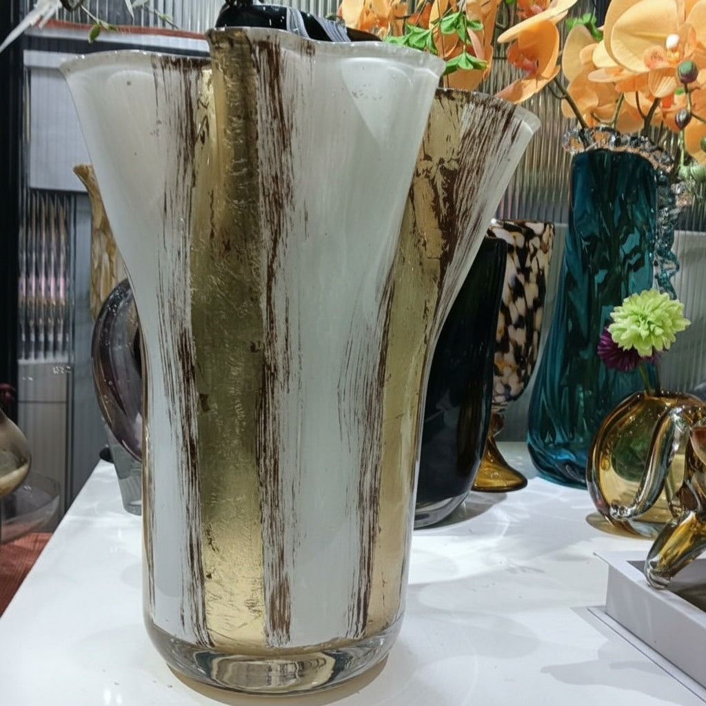 Side view of art glass vase with gold brushstrokes