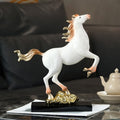 Angled view of glossy white horse statue with gold mane details