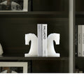 Pair of white marble horse head bookends holding books