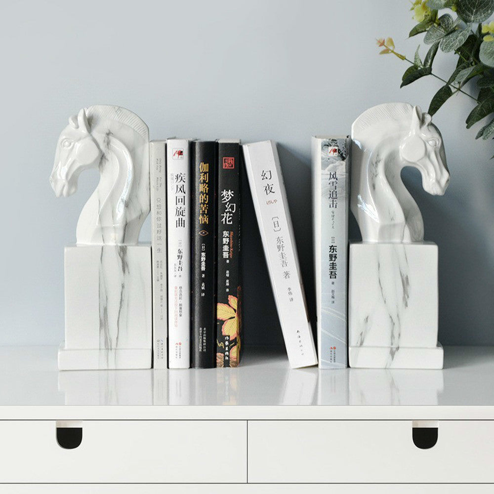 Front view of marble effect horse bookends holding books