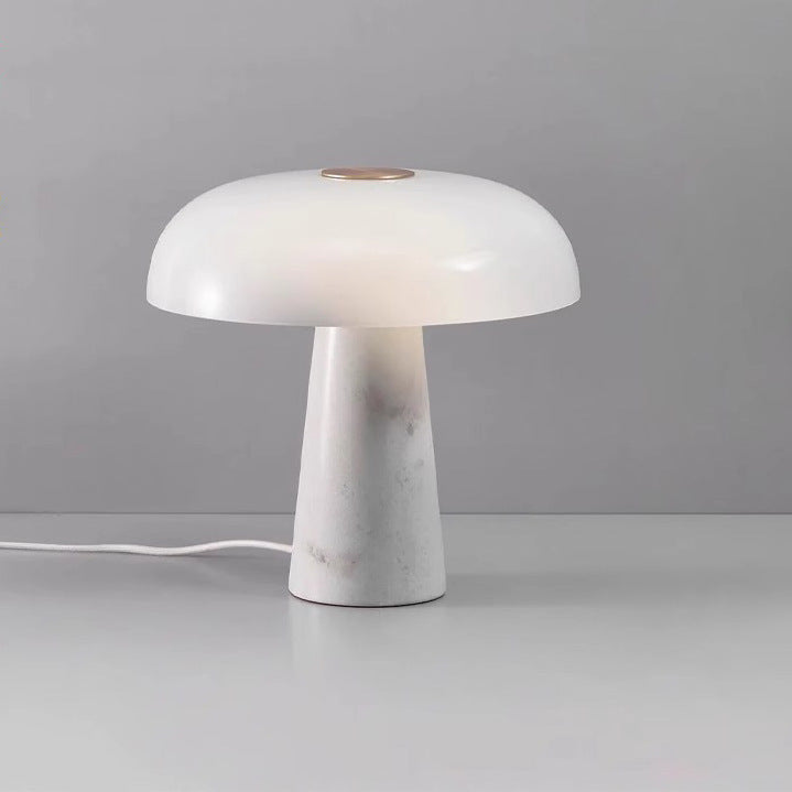 Studio front view of white marble and opal glass table lamp