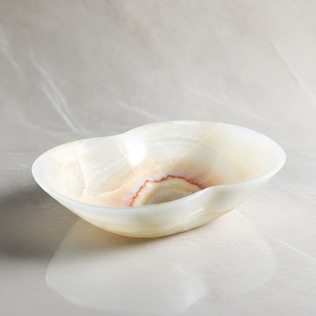 Angled view of empty white onyx decorative bowl