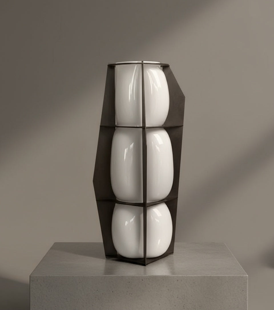 Close up of segmented white glass vase in metal framework