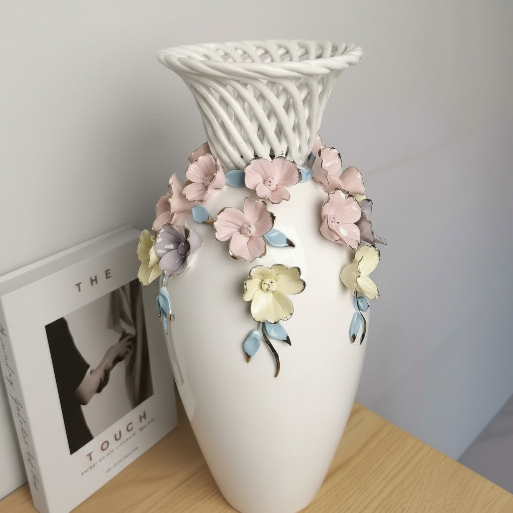 White porcelain vase with woven lattice rim and pastel flowers