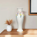 Tall white vase with lattice neck and ceramic flowers