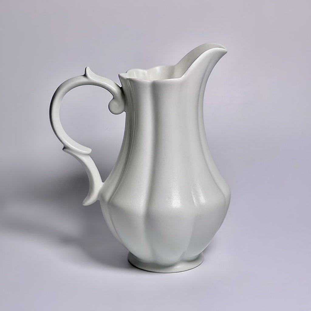 White porcelain fluted pitcher with curved handle