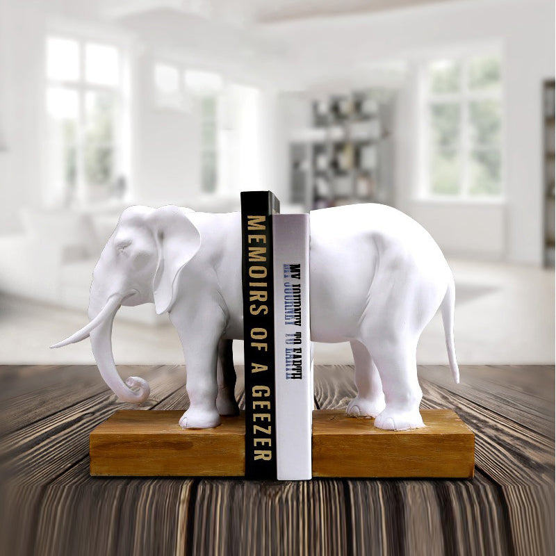 Angled view of elephant bookends holding books