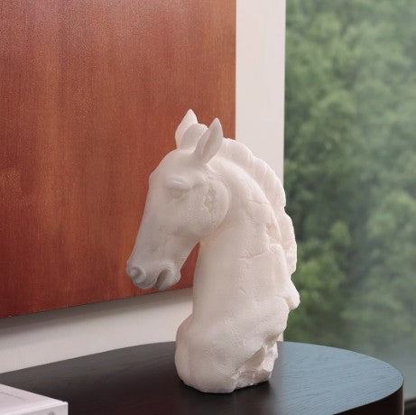 Side profile view of white resin horse head sculpture