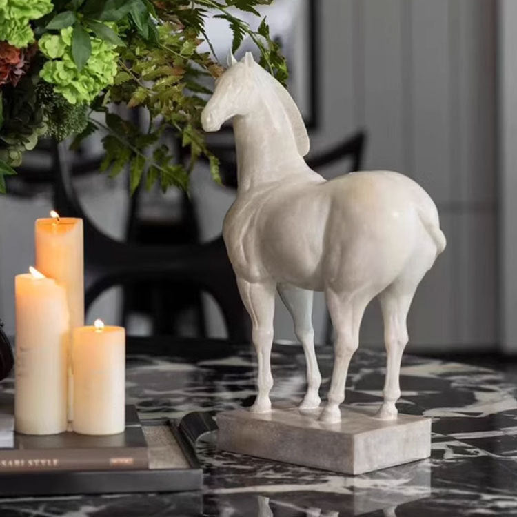 Rear angle of standing horse figurine near candles