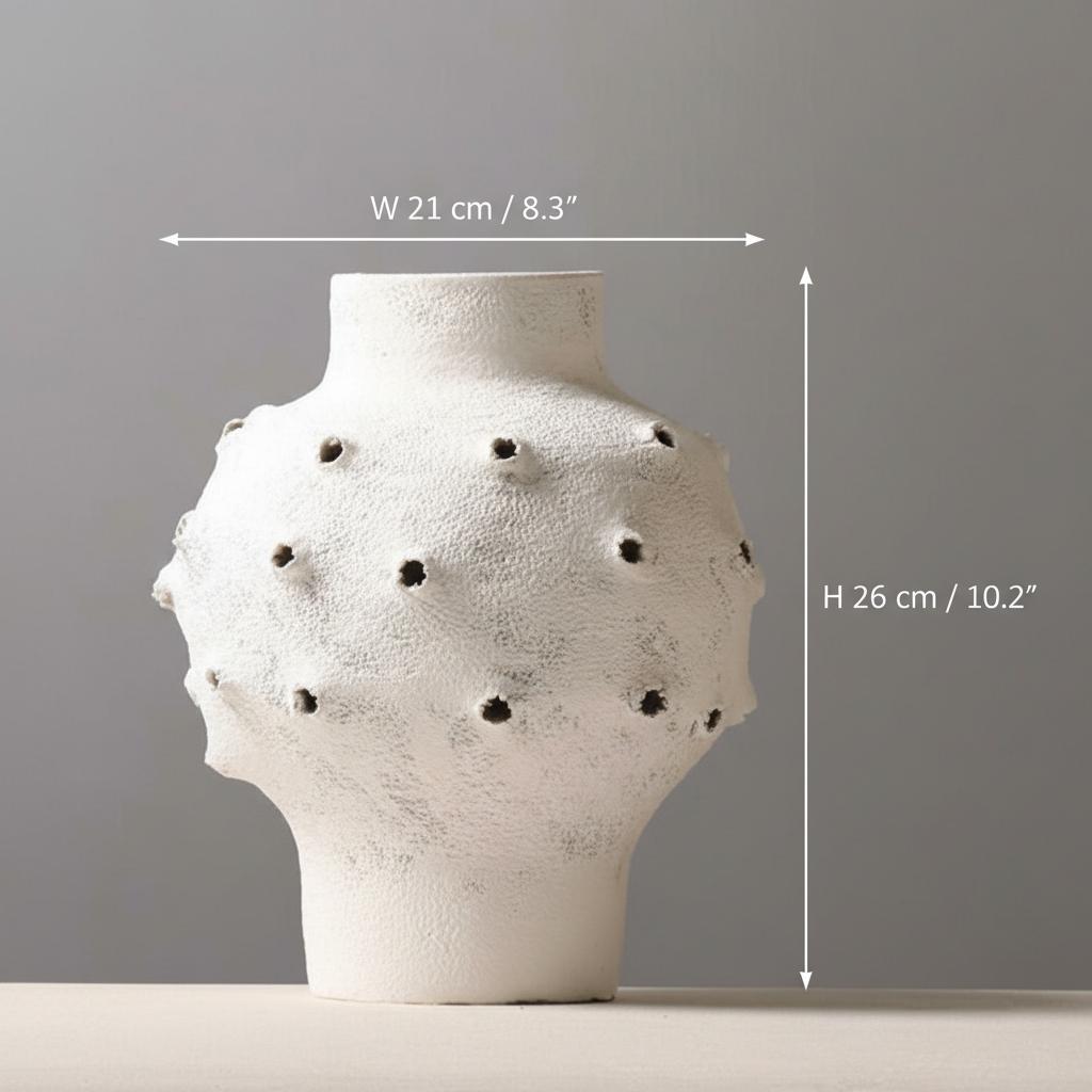 Front view of round white textured ceramic vase