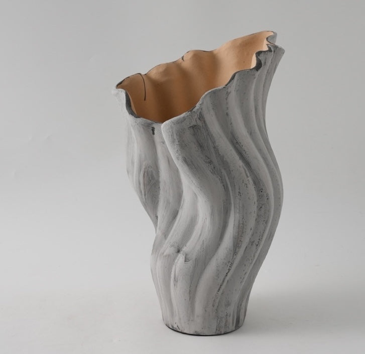 Large distressed grey ceramic fluted vase angle view