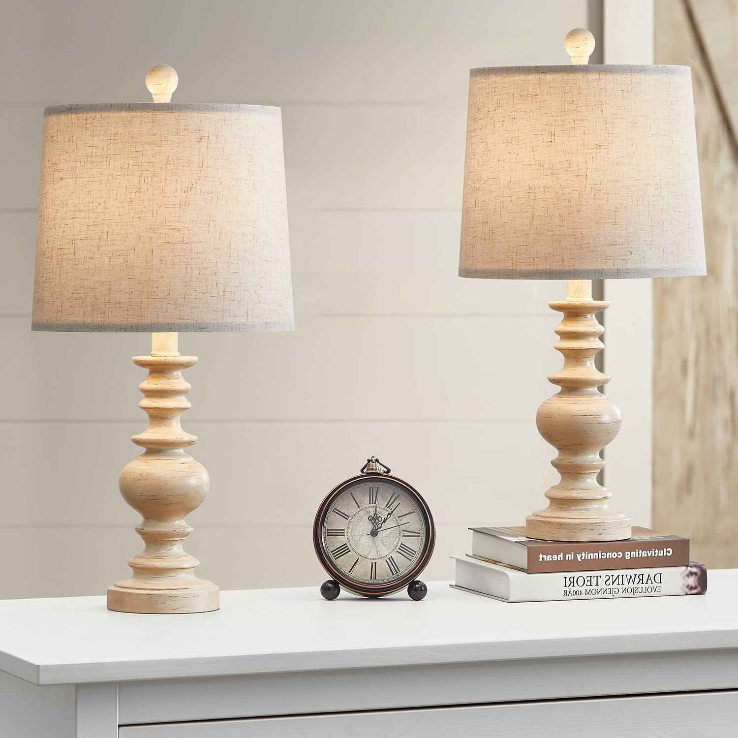 Front view of two whitewashed wood table lamps with linen shades