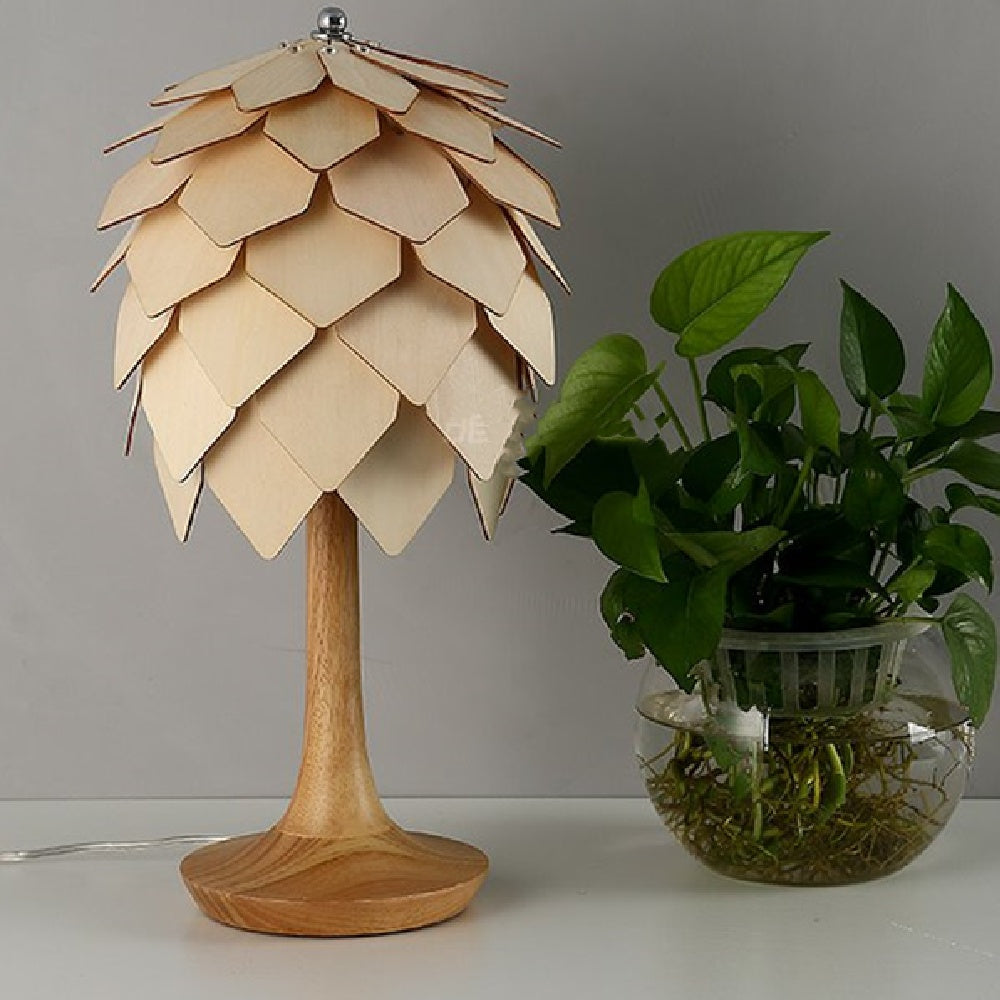 Unlit pinecone table lamp showing natural wood grain detail
